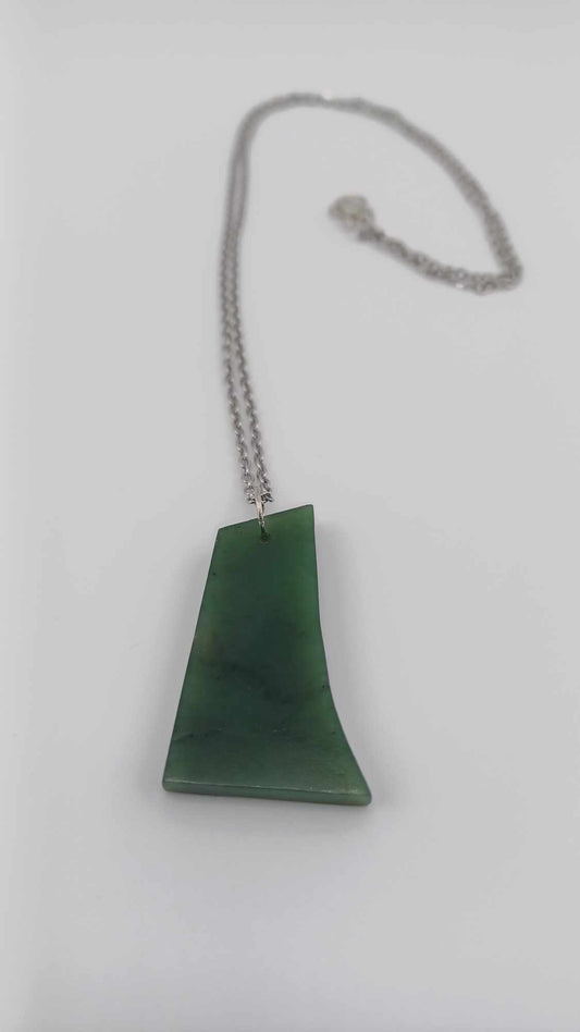 British Columbia Nephrite Jade Curved Pendant Necklace laying flat