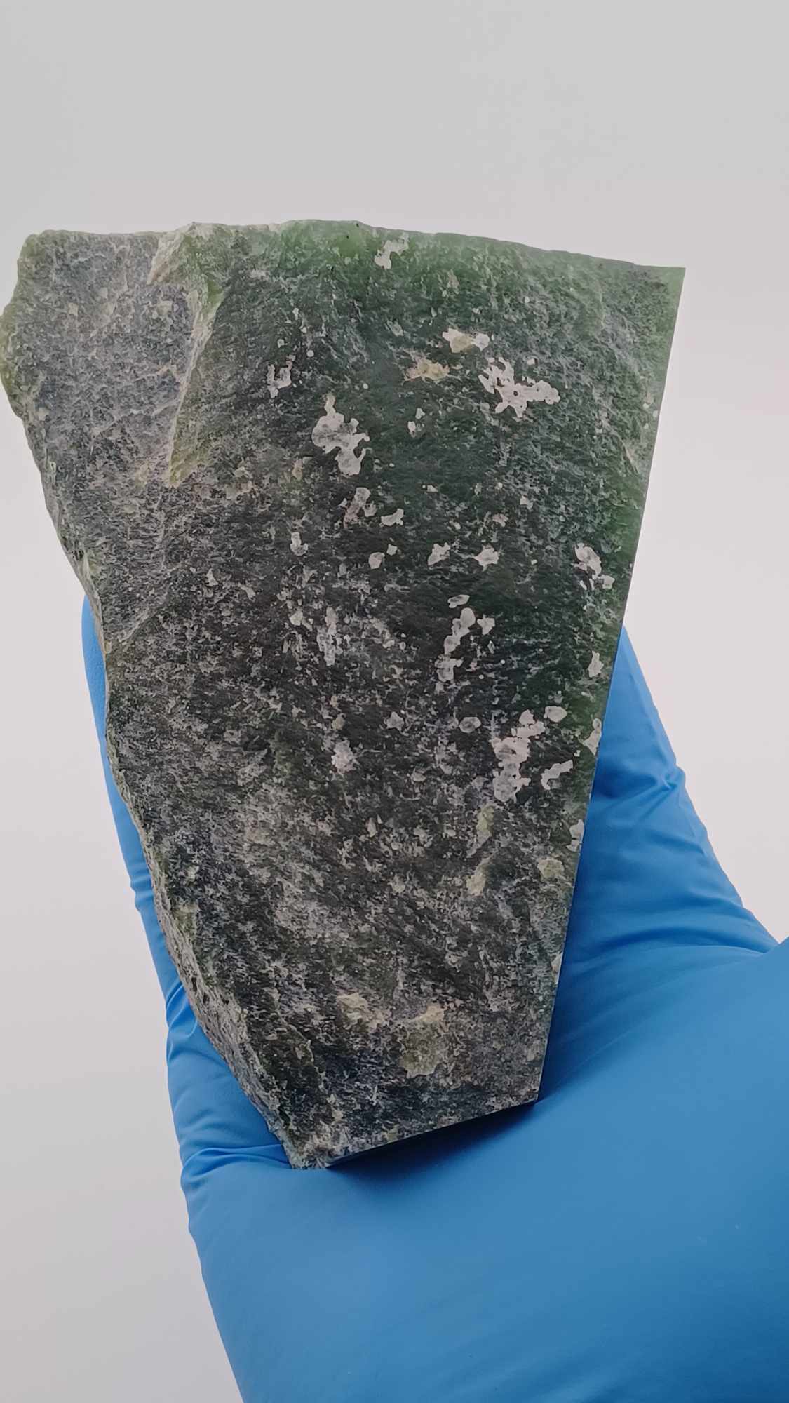 back of High-resolution image of a Cassiar Nephrite Jade Slab High Translucency 547g showcasing its luminous, translucent green jade with intricate Colors of Light Transparent Green